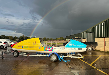YDSA CHAIRMAN, TIM BARKER, SURVEYS ROWING BOAT WHICH WILL CROSS THE ATLANTIC